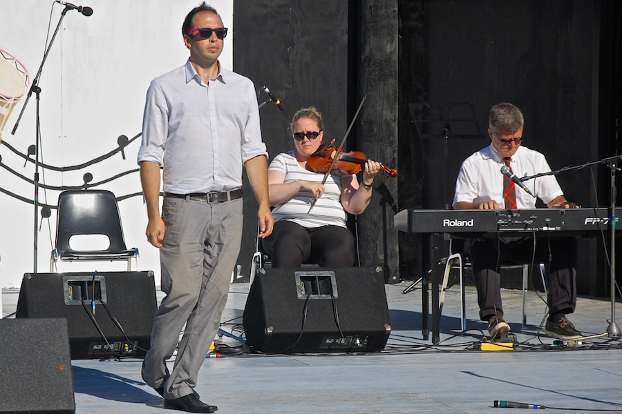 Kolten MacDonell step‑dancing to the music of Dara Smith-MacDonald on fiddle and Lawrence Cameron on keyboard