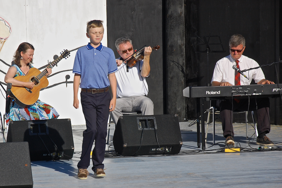 Iain MacQuarrie step-dancing to the music of Howie MacDonald on fiddle, Lawrence Cameron on keyboard, and  Mary Beth Carty on guitar