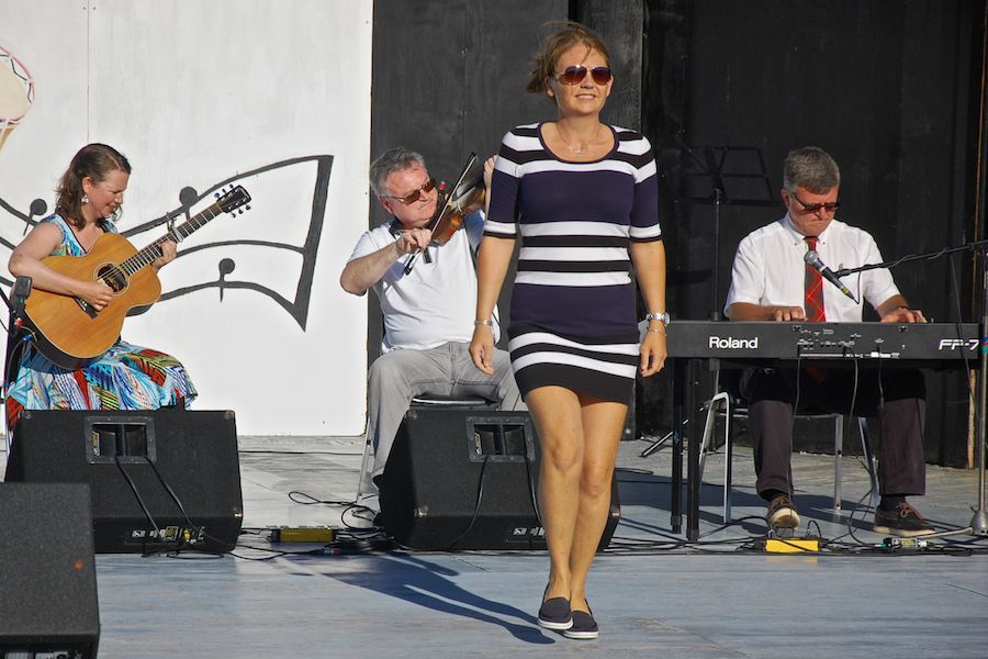 Cheryl MacQuarrie step-dancing to the music of Howie MacDonald on fiddle, Lawrence Cameron on keyboard, and  Mary Beth Carty on guitar