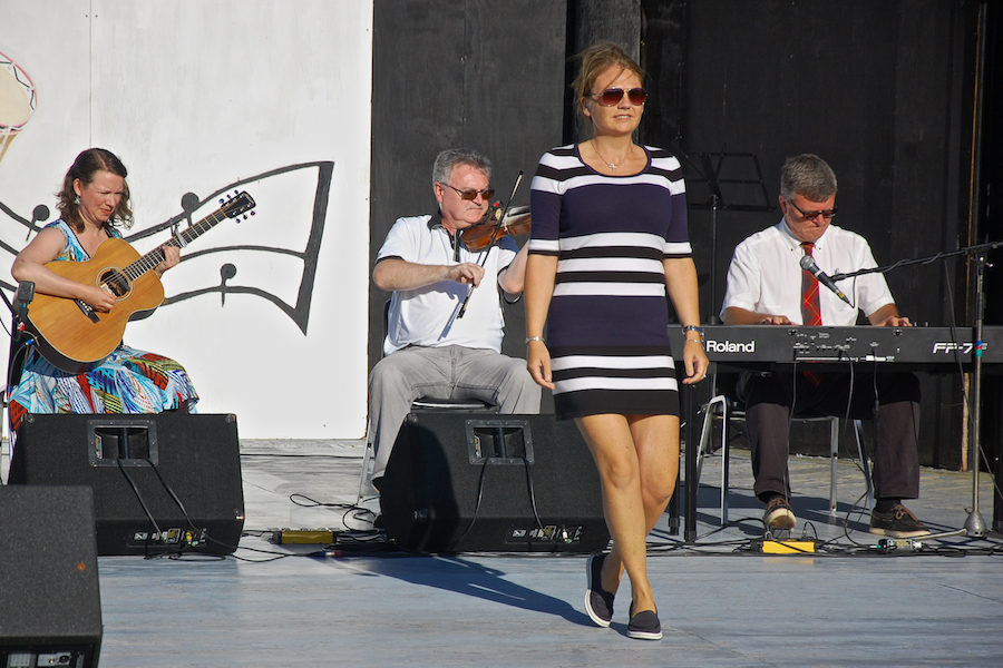 Cheryl MacQuarrie step-dancing to the music of Howie MacDonald on fiddle, Lawrence Cameron on keyboard, and  Mary Beth Carty on guitar