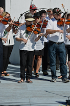 The Cape Breton Fiddlers’ Association plays its second group number in tribute