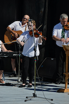 The Cape Breton Fiddlers’ Association plays its second group number in tribute
