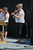 The Cape Breton Fiddlers’ Association plays its second group number in tribute