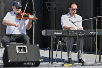 Bernard MacDonnell on fiddle accompanied by Kolten MacDonell on keyboard