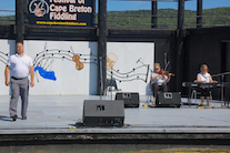 Rodney MacDonald step‑dancing to the music of Dara Smith-MacDonald on fiddle and Susan MacLean on keyboard