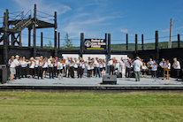 The Cape Breton Fiddlers’ Association plays its second group number in tribute, directed by Eddie Rogers and accompanied by Susan MacLean on keyboard