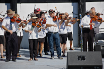 The Cape Breton Fiddlers’ Association plays its second group number in tribute