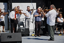 The Cape Breton Fiddlers’ Association plays its second group number in tribute