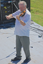 Eddie Rogers directing and on fiddle