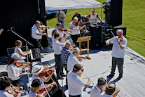 The Cape Breton Fiddlers’ Association plays its second group number in tribute