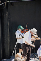 The Cape Breton Fiddlers’ Association plays its second group number in tribute