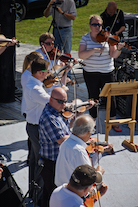 The Cape Breton Fiddlers’ Association plays its second group number in tribute