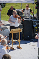 The Cape Breton Fiddlers’ Association plays its second group number in tribute