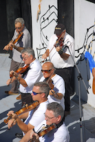 The Cape Breton Fiddlers’ Association plays its second group number in tribute