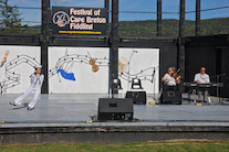 Drea Shepherd dancing The Sailor’s Hornpipe to the music of Dara Smith-MacDonald on fiddle and Kolten MacDonell on keyboard