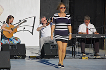 Cheryl MacQuarrie step-dancing to the music of Howie MacDonald on fiddle, Lawrence Cameron on keyboard, and  Mary Beth Carty on guitar