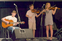John Angus and Mary Anna MacNeil on dual fiddles, accompanied by Malcolm MacNeil on guitar