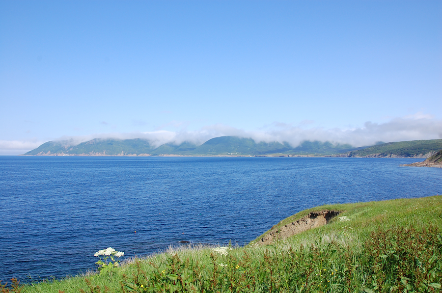 The Cape North Massif shrouded in clouds across Bay St Lawrence