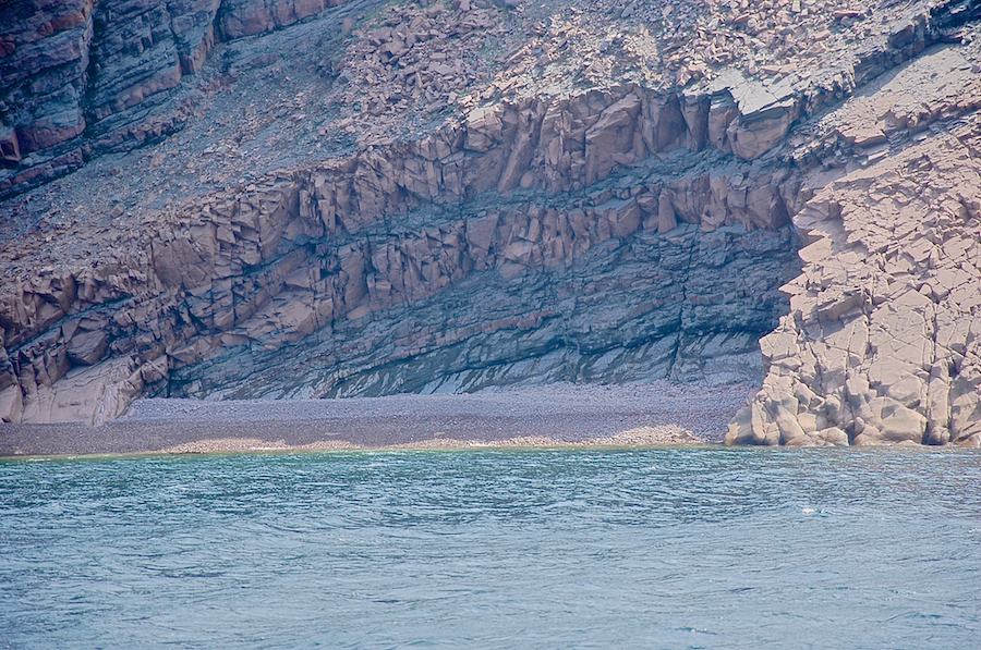 The beach and the hollow below the ridged cliffs