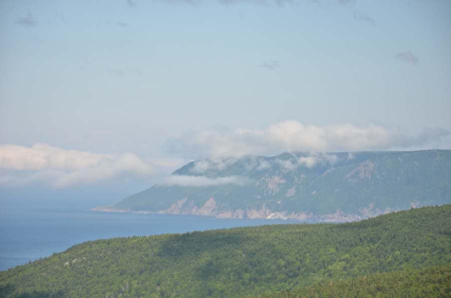 The fog bank crashes into the Cape North Massif