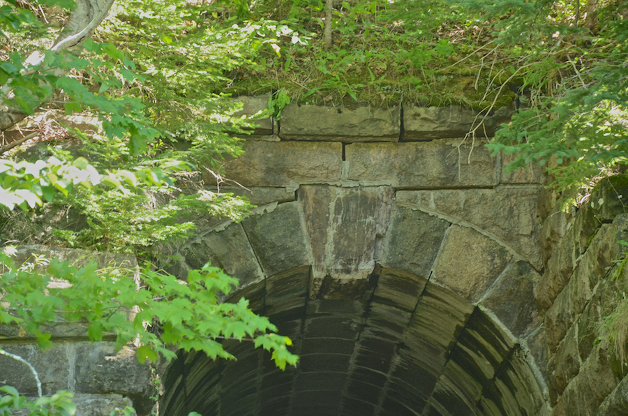 The upper part of the arch and the bed of the railway