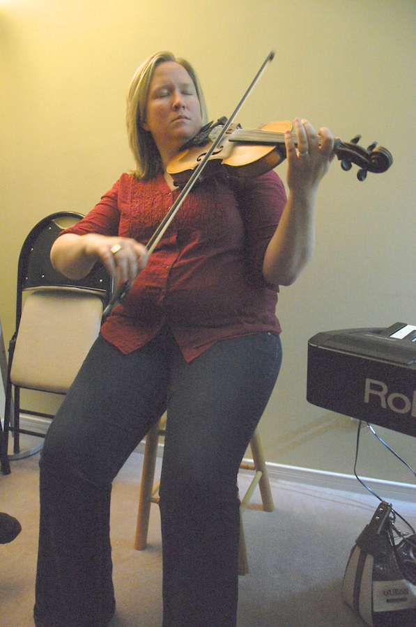 Photo of Dara Smith-MacDonald on fiddle