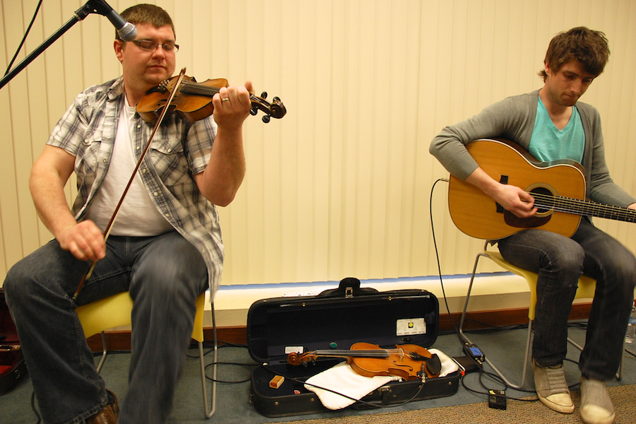 Photo of J. J. Chaisson on fiddle accompanied by Koady Chaisson on guitar