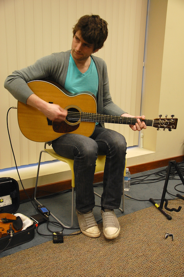 Photo of Koady Chaisson on guitar