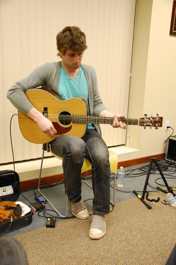 Photo of Koady Chaisson on guitar