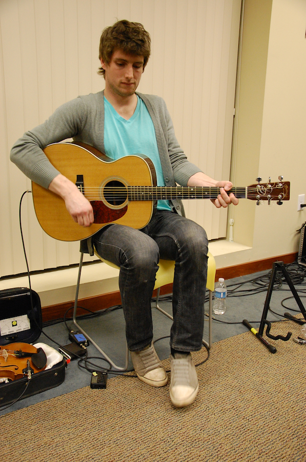 Photo of Koady Chaisson on guitar