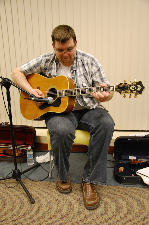 Photo of J. J. Chaisson on guitar