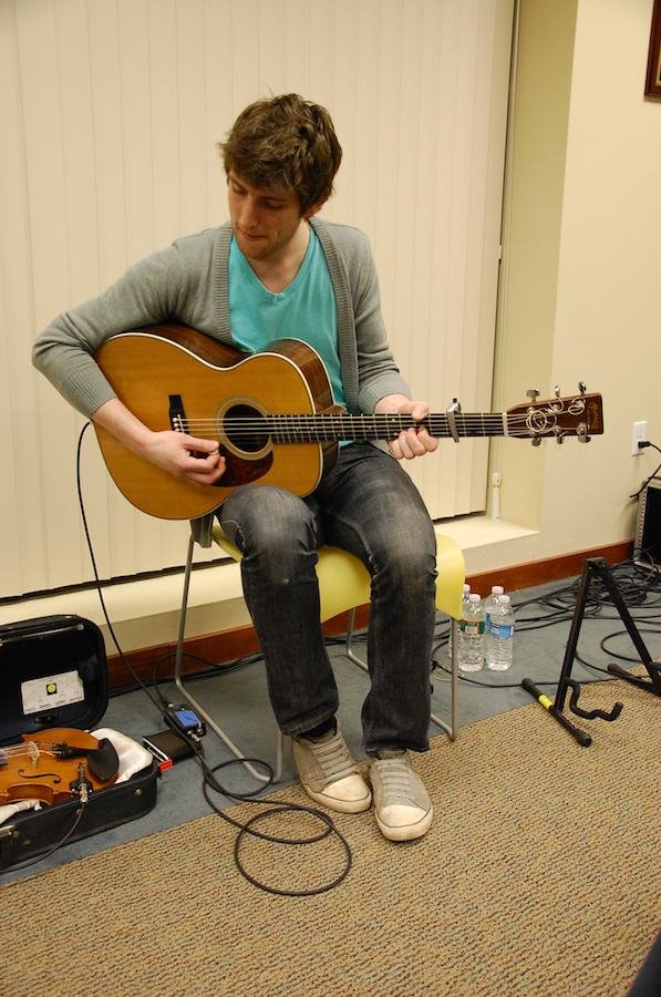 Photo of Koady Chaisson on guitar