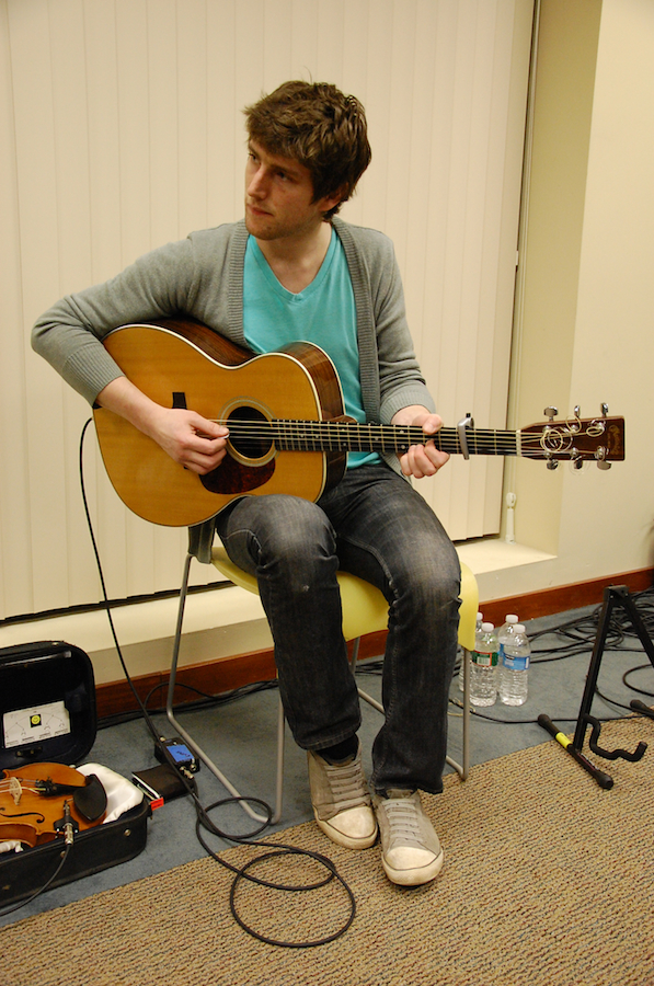 Photo of Koady Chaisson on guitar