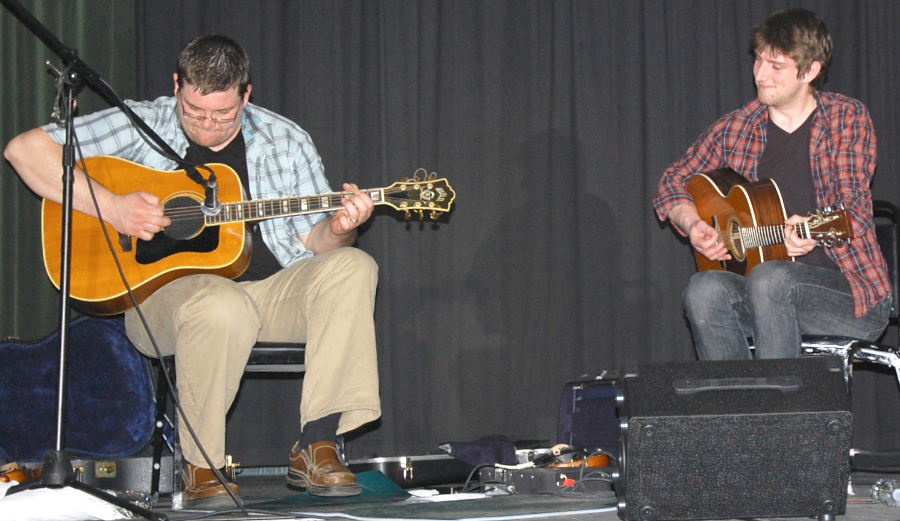 Photo of J. J. Chaisson on fiddle accompanied by Koady Chaisson on guitar