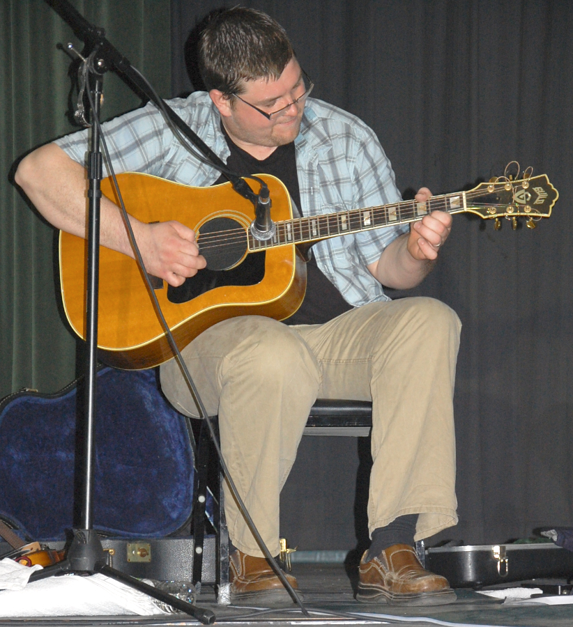Photo of J. J. Chaisson on guitar
