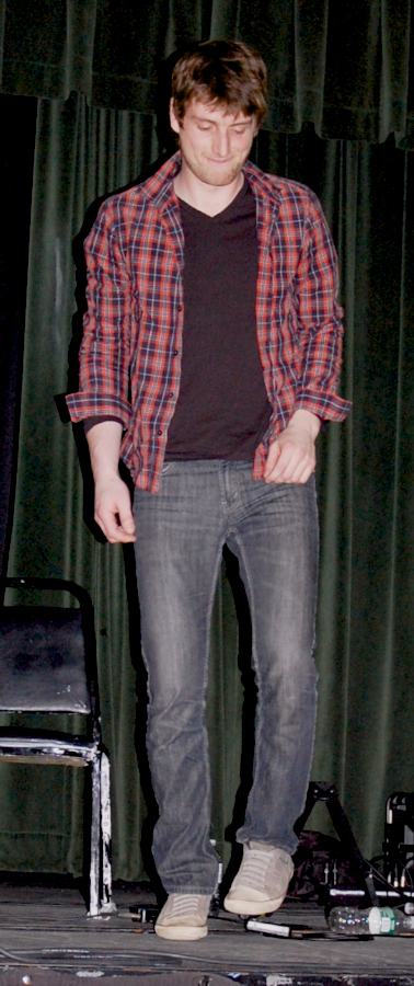 Photo of Koady Chaisson step-dancing to the music of J. J. Chaisson and Zoë Darrow
