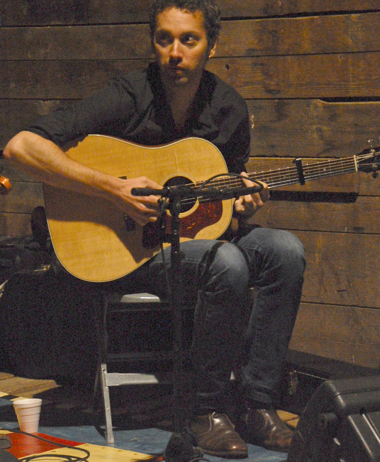 Photo of Seph Peters on guitar